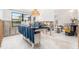 Large kitchen with an island covered with blue cloth during renovation at 4662 Dewey Dr, New Port Richey, FL 34652