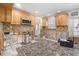 Kitchen with a stylish tile floor and oak colored cabinets and under renovation at 4662 Dewey Dr, New Port Richey, FL 34652