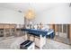 Large kitchen area with an island covered with blue cloth during renovation at 4662 Dewey Dr, New Port Richey, FL 34652