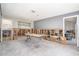 Large open living space with an open floor plan and attached bathroom under construction at 4662 Dewey Dr, New Port Richey, FL 34652