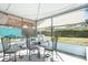 Relaxing sunroom with screened windows, perfect for enjoying the outdoors at 4662 Dewey Dr, New Port Richey, FL 34652