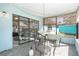 Relaxing sunroom with screened windows, perfect for enjoying the outdoors at 4662 Dewey Dr, New Port Richey, FL 34652