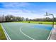 Enjoy a full-sized basketball court, perfect for residents and guests to play a game at 4956 Rolling Green Dr, Wesley Chapel, FL 33543