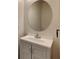 Chic bathroom with modern vanity, mirror, and fixtures at 518 Glenn Cross Dr, Ruskin, FL 33570