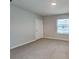 This bedroom features neutral walls, carpet flooring, and a window with blinds at 518 Glenn Cross Dr, Ruskin, FL 33570