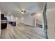 Spacious living area featuring wood laminate flooring, neutral walls, and adjoining kitchen at 518 Glenn Cross Dr, Ruskin, FL 33570