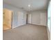 Large primary bedroom with neutral walls, carpet flooring, and natural light at 518 Glenn Cross Dr, Ruskin, FL 33570