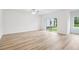 Bright and airy living room with sliding glass doors overlooking backyard at 5588 Delight Ave, North Port, FL 34288