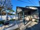 A cozy backyard featuring a concrete patio, outdoor seating, and a privacy fence, perfect for entertaining guests at 600 26Th S Ave, St Petersburg, FL 33705