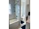 Bathroom featuring a shower with marble surround and modern fixtures at 600 26Th S Ave, St Petersburg, FL 33705