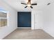 This bedroom features neutral tile floors and a stylish accent wall at 600 26Th S Ave, St Petersburg, FL 33705
