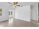 Bright living room offers new floors, fresh paint, lots of windows, and a ceiling fan at 600 26Th S Ave, St Petersburg, FL 33705