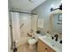 Updated bathroom with modern vanity, stylish fixtures, and tiled shower with tub at 6707 Thorman Rd, Port Charlotte, FL 33981
