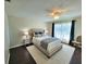 Bedroom features wood floors, plush bed, and ample natural light at 6707 Thorman Rd, Port Charlotte, FL 33981