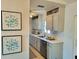 Stylish kitchen featuring neutral cabinets, stainless steel appliances and light countertops at 6707 Thorman Rd, Port Charlotte, FL 33981