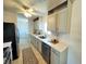 Modern kitchen with gray cabinets, stainless steel appliances, and tiled backsplash at 6707 Thorman Rd, Port Charlotte, FL 33981