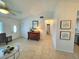 Inviting living room with tile floors, a decorative mirror, and natural light at 6707 Thorman Rd, Port Charlotte, FL 33981