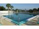 Community pool featuring clear water and a calming view of the surrounding nature at 6707 Thorman Rd, Port Charlotte, FL 33981