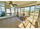 Bright sunroom featuring tile floors and floor-to-ceiling windows at 6707 Thorman Rd, Port Charlotte, FL 33981