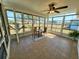 Bright sunroom featuring tile floors and floor-to-ceiling windows at 6707 Thorman Rd, Port Charlotte, FL 33981