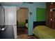 Cozy bedroom with mirrored closet doors, bright green blinds, and neutral wall colors at 7219 Williams S Dr, St Petersburg, FL 33705