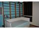 Stylish bedroom featuring built-in shelving and a daybed at 7219 Williams S Dr, St Petersburg, FL 33705