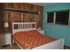 Cozy bedroom with unique wood paneling and a comfortable bed at 7219 Williams S Dr, St Petersburg, FL 33705
