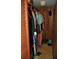 Organized closet featuring wood paneling, clothing racks, and storage space for shoes at 7219 Williams S Dr, St Petersburg, FL 33705