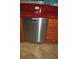 A stainless steel Miele dishwasher is installed beneath the red countertop and orange cabinetry at 7219 Williams S Dr, St Petersburg, FL 33705