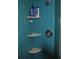 Stand up shower with bright blue tile and built in shelves at 7219 Williams S Dr, St Petersburg, FL 33705