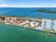 Scenic aerial view of waterfront condo community with boat docks, pool, and stunning ocean views at 7310 Sunshine Skyway S Ln # 219, St Petersburg, FL 33711
