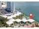 Overhead view of waterfront condominium complex featuring a private boat dock and community swimming pool at 7310 Sunshine Skyway S Ln # 219, St Petersburg, FL 33711