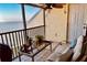 Relaxing balcony area with furniture overlooking a scenic waterfront view at 7310 Sunshine Skyway S Ln # 219, St Petersburg, FL 33711