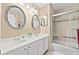 Bathroom featuring a double sink vanity and shower-tub combination at 7310 Sunshine Skyway S Ln # 219, St Petersburg, FL 33711