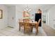 Bright dining room with decorative chandelier and adjacent kitchen and bedroom at 7310 Sunshine Skyway S Ln # 219, St Petersburg, FL 33711