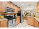 Efficient kitchen with stainless steel appliances and an open layout at 7310 Sunshine Skyway S Ln # 219, St Petersburg, FL 33711