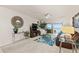 Living room with fireplace, water view, balcony, and ceiling fan at 7310 Sunshine Skyway S Ln # 219, St Petersburg, FL 33711