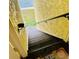 Stairwell leading towards the beach with walls featuring a textured finish at 7310 Sunshine Skyway S Ln # 219, St Petersburg, FL 33711