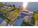 Aerial view of the home showcasing its waterfront location, boat lift, and outdoor amenities at 8841 W Millpoint Rd, Riverview, FL 33578