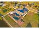 Gorgeous waterfront home featuring a screened-in pool, fire pit, private dock, and a spacious backyard at 8841 W Millpoint Rd, Riverview, FL 33578