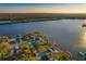 An aerial shot shows the waterfront property with lush trees and a bayou at 8841 W Millpoint Rd, Riverview, FL 33578