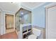 Bathroom showcasing the shower with glass door and blue walls at 8841 W Millpoint Rd, Riverview, FL 33578