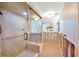 Bathroom featuring tile floors, shower, and a classic window at 8841 W Millpoint Rd, Riverview, FL 33578