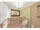 Bathroom features tile floors, shower with glass door, and a decorative mirror at 8841 W Millpoint Rd, Riverview, FL 33578