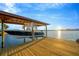 Modern covered boat lift provides convenience for boating enthusiasts and waterfront living at 8841 W Millpoint Rd, Riverview, FL 33578
