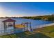 Panoramic view of a private dock with a boat lift and waterfront access at 8841 W Millpoint Rd, Riverview, FL 33578