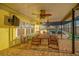 Covered patio that is perfect for outdoor dining and entertaining overlooking pool at 8841 W Millpoint Rd, Riverview, FL 33578