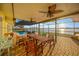 Enjoy outdoor dining with a view from this spacious, covered patio overlooking the waterfront at 8841 W Millpoint Rd, Riverview, FL 33578