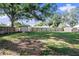 Wood privacy fence surrounding well manicured backyard, featuring a storage shed at 917 2Nd Nw Ave, Largo, FL 33770