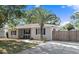 Charming single-story home featuring a well-maintained front yard, a mature palm tree, and a convenient driveway at 917 2Nd Nw Ave, Largo, FL 33770
